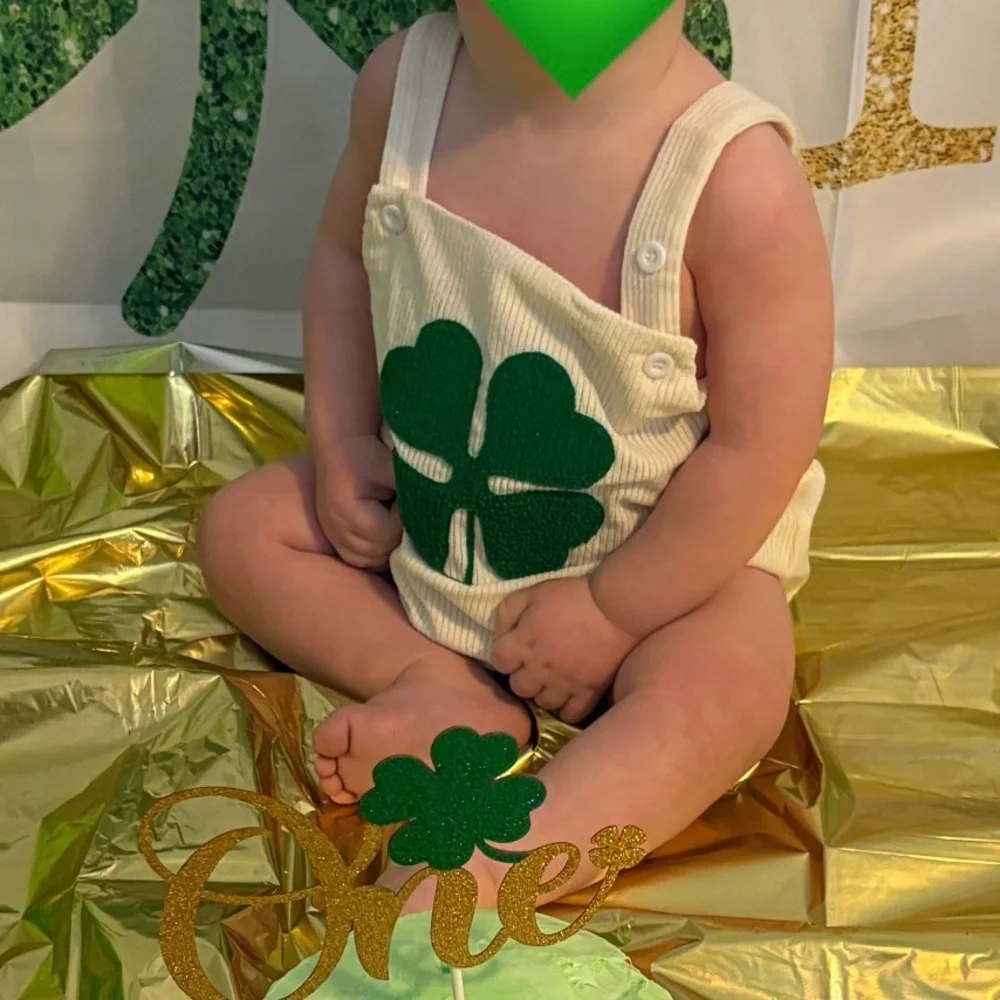 Lucky one first birthday cake smash outfit and decor